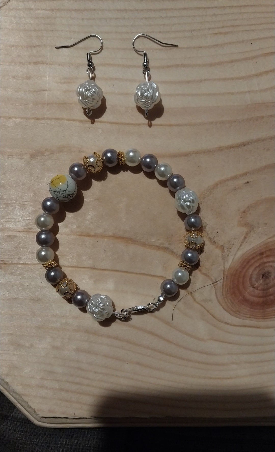 Silver Mist Pearl and Floral Bracelet and Earring Set on wooden surface