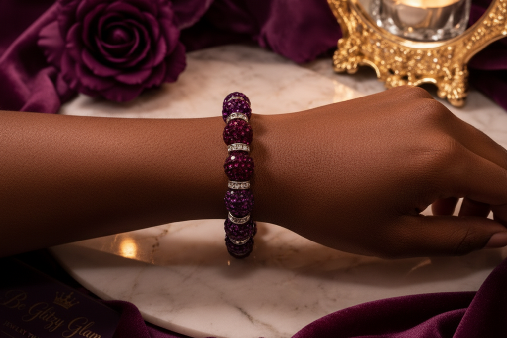 Close-up of purple crystal pavé bracelet on a Black woman's wrist